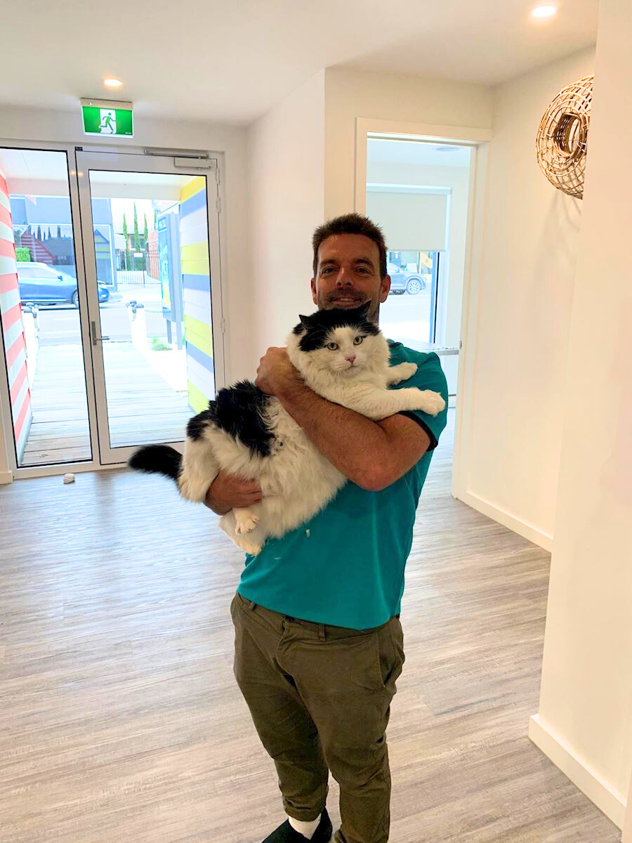 Dr James holding a large cat